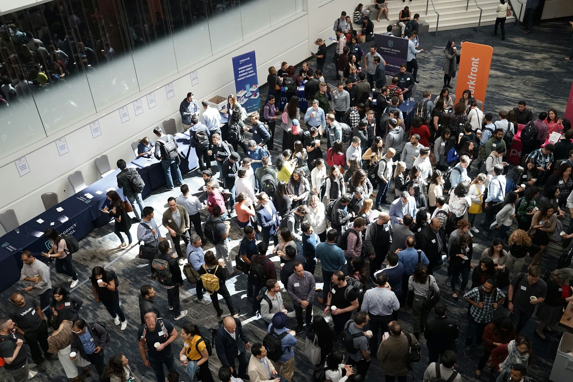An aerial view of a dense public crowd